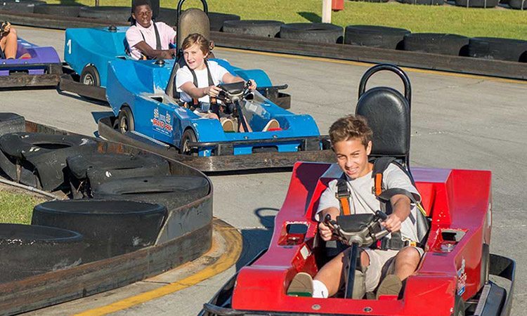 kids racing in go karts